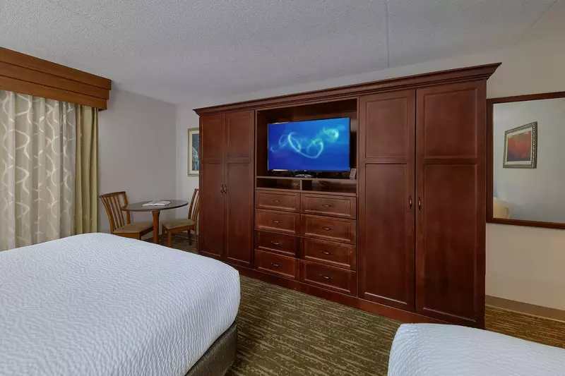 Two Queen Beds facing TV