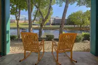 rocking chairs on patio facing the river