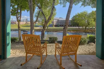 rocking chairs on patio looking out at river view