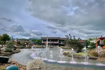 overcast weather at fountain at the island with skyfly soar america in distance