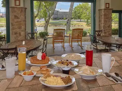 breakfast on plate with river in the background