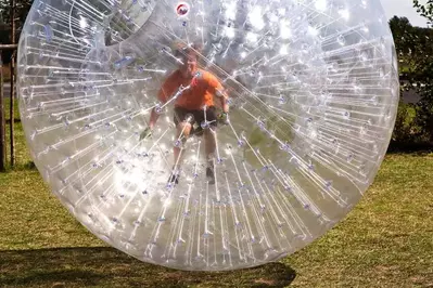 boy in a zorbing ball