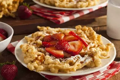 funnel cake topped with strawberries