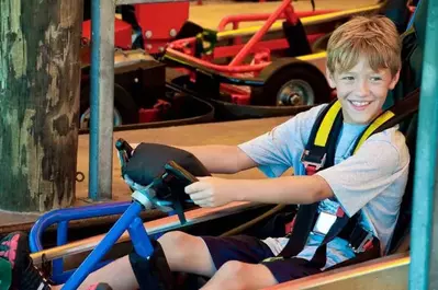 Young boy smiling on go kart in Pigeon Forge TN