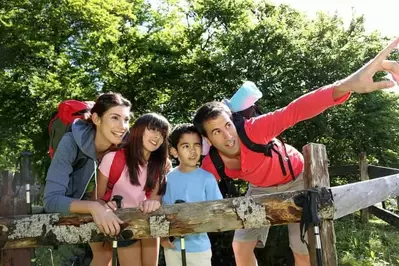 Family enjoying a hike in the woods.