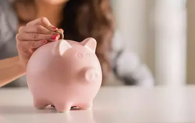 Adding money to a piggy bank