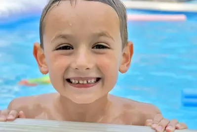 kid playing in a Pigeon Forge hotel with indoor pool