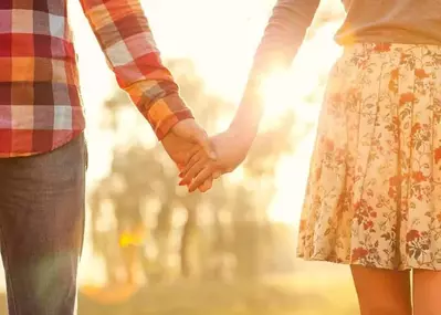 Couple holding hands in the mountains