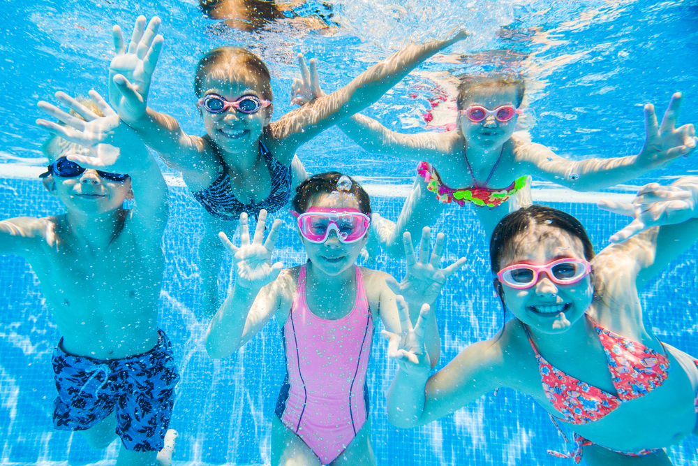 kids underwater in pool