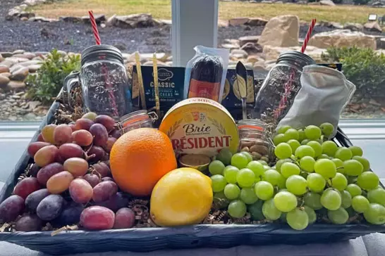 Ultimate Snack Basket with fruit, cheese, crackers, nuts, and other snacks