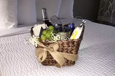 Ultimate Wine Basket with bottle of wine, grapes, and glasses