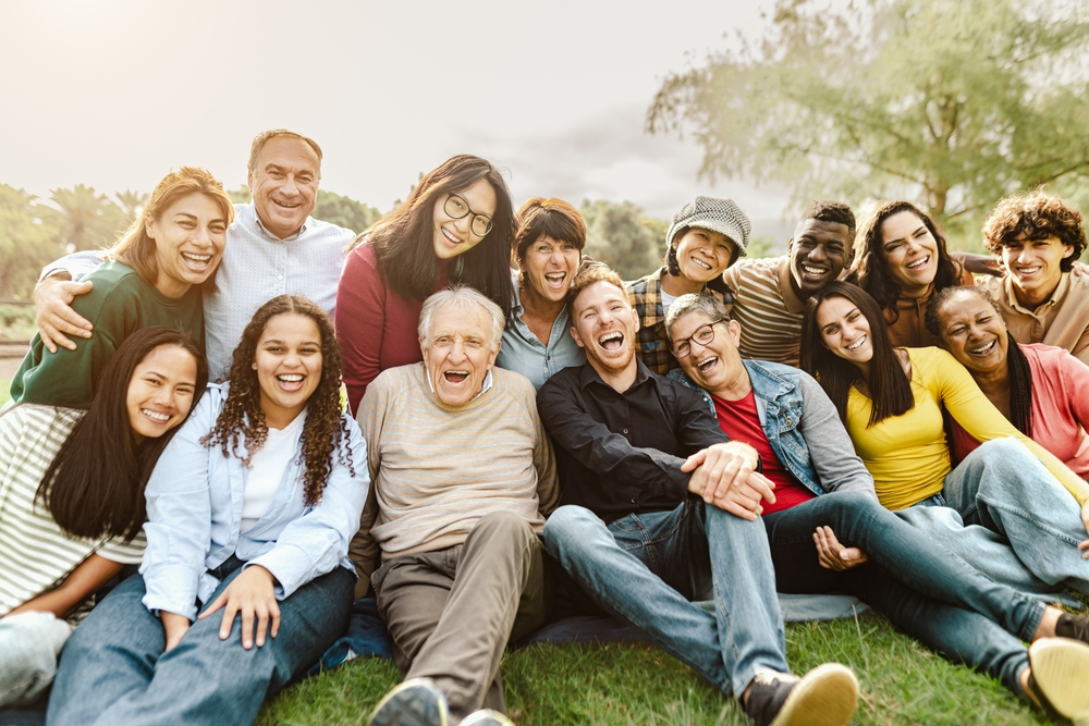 multi-generational family smiling at camera