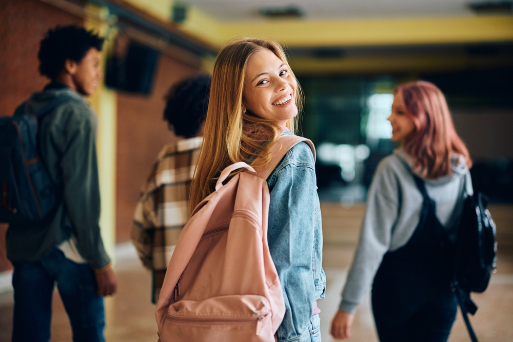 students wearing backpacks