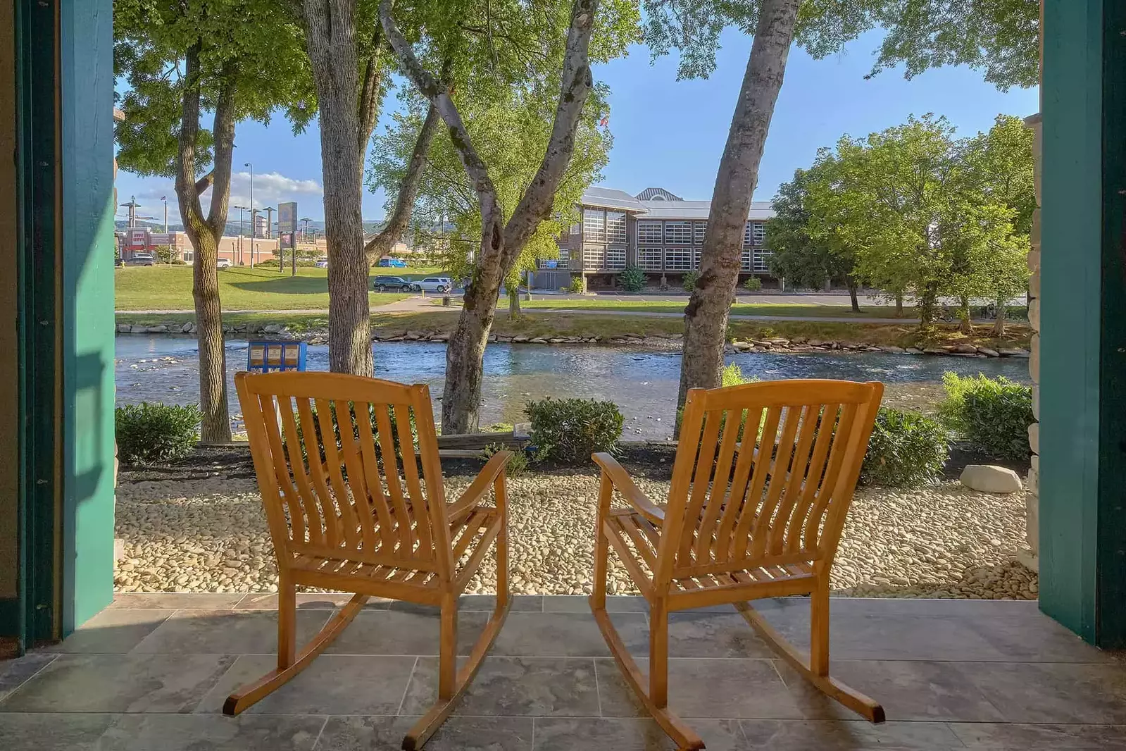 rocking chairs on Inn on the River patio looking out at Little Pigeon River