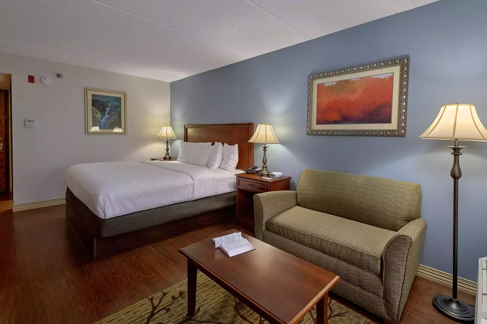 One King Bed with Full Sleeper Sofa in hotel room in Pigeon Forge