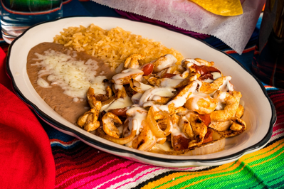 Mexican chicken and cheese with rice and beans