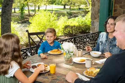 family eating breakfast at The Inn on the River