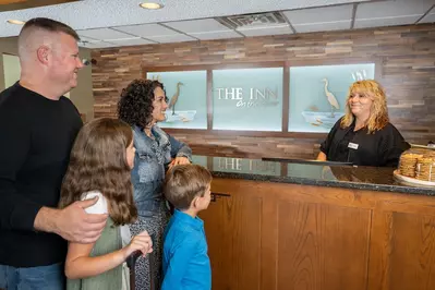 family at front desk at our Pigeon Forge hotel